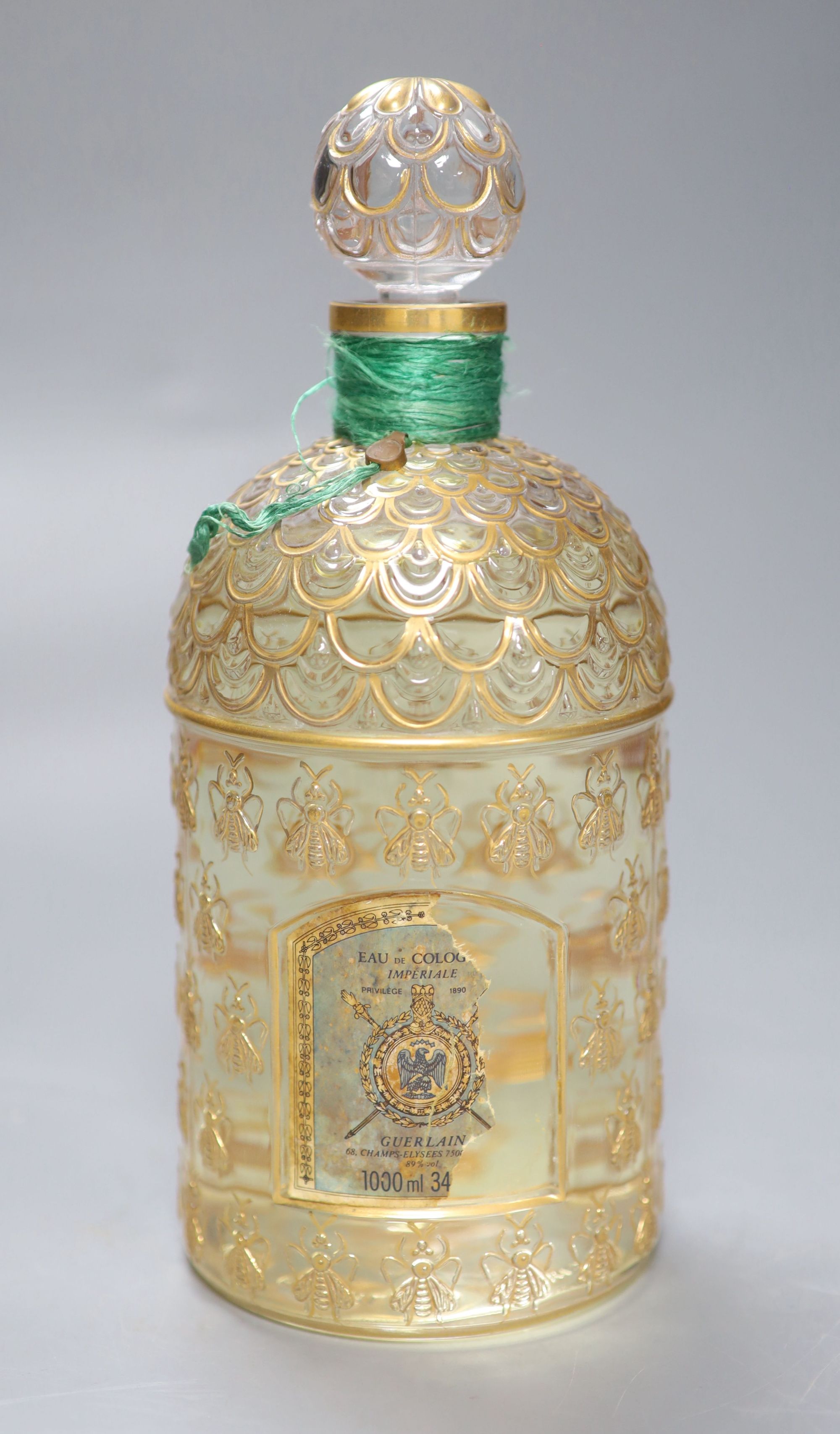 A Guerlain eau de Cologne Imperiale 1000ml bottle, label torn, height 25cm